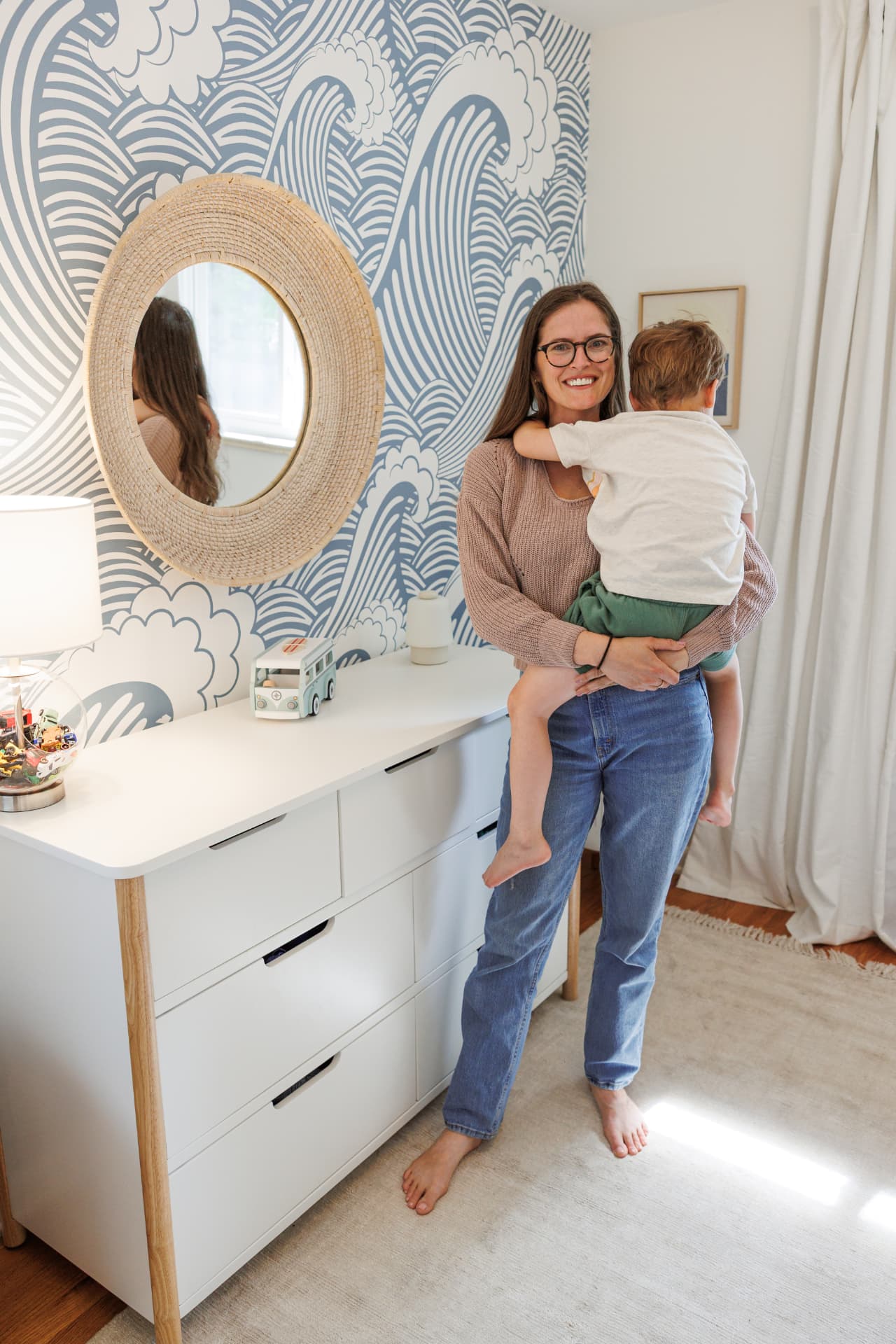 Jillian holding her toddler in a calm nursery